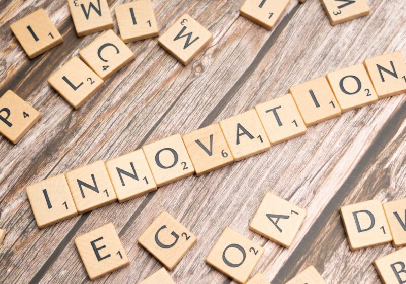 The word innovation spelled in letter tiles